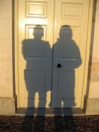 two shadows on a door