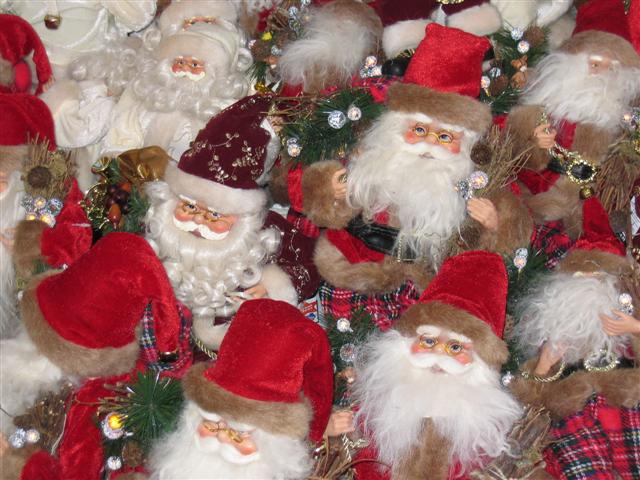 Wall of stuffed Santas